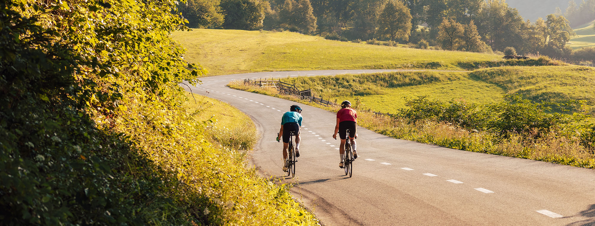 Two,Road,Cyclists,,Male,And,Female,During,Training,At,Beautiful